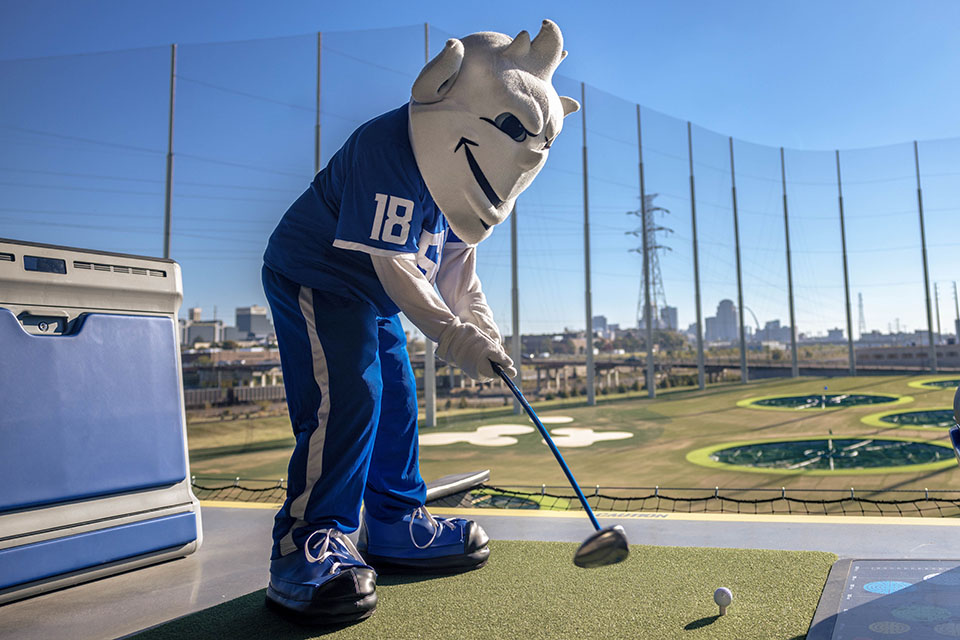 The Billiken tees off at the new Topgolf St. ֱοƵ Midtown after the ribbon-cutting ceremony on October 20, 2023.