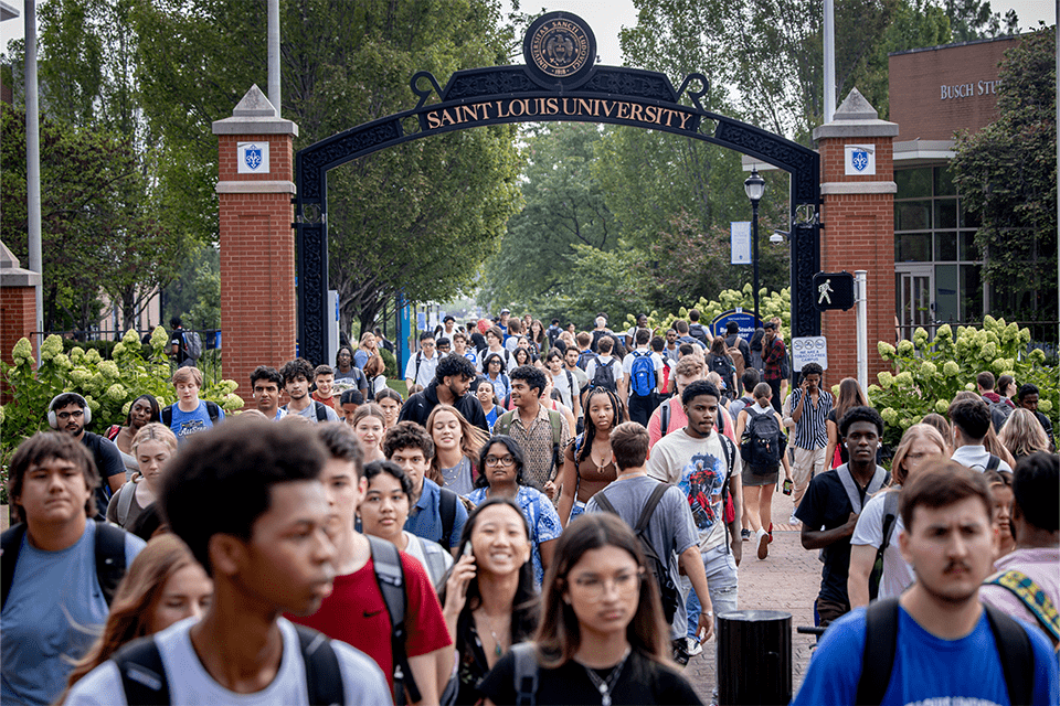 Students walk to class on the first day of classes on Saint ֱοƵ University's campus.